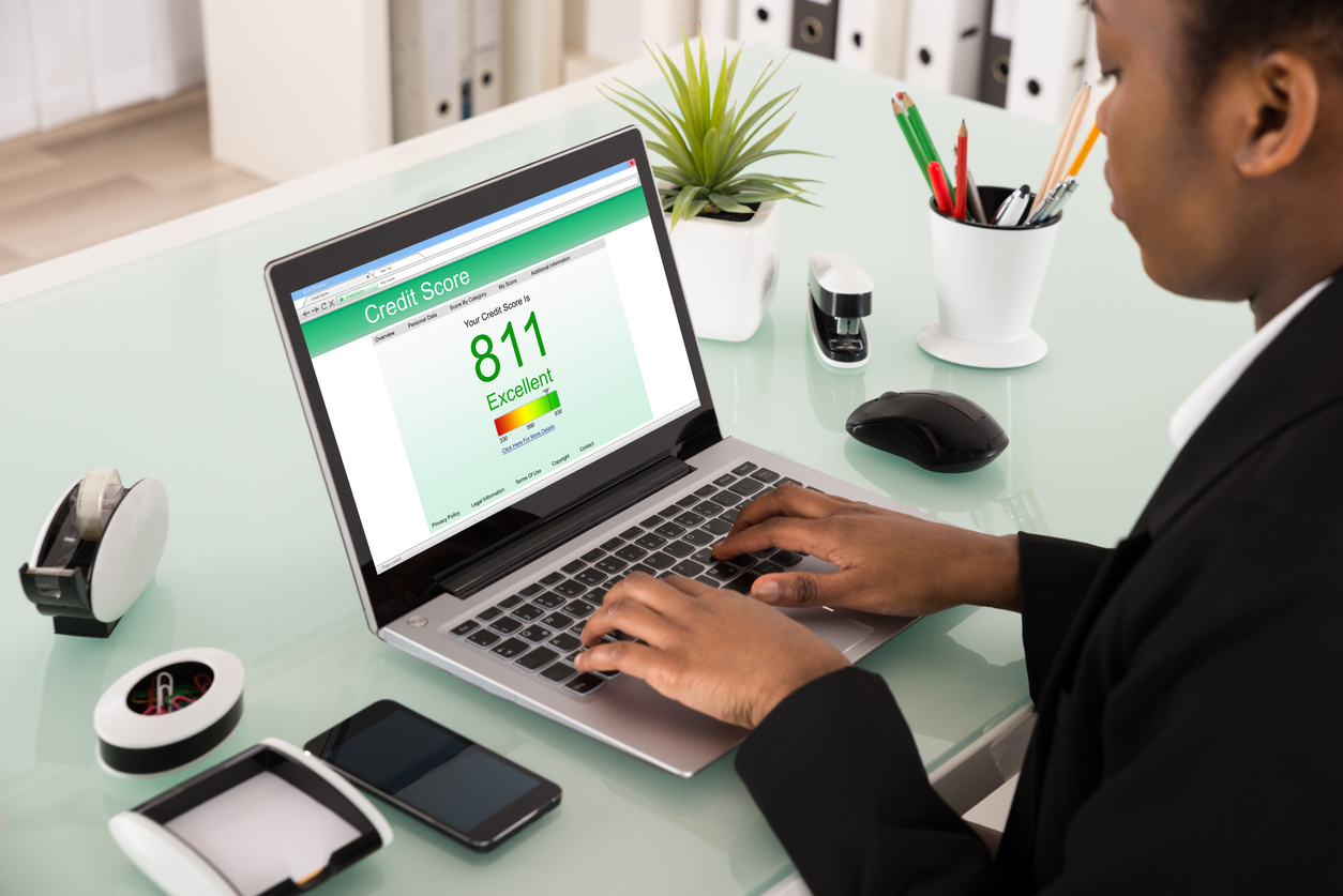 A businesswoman checks her credit report
