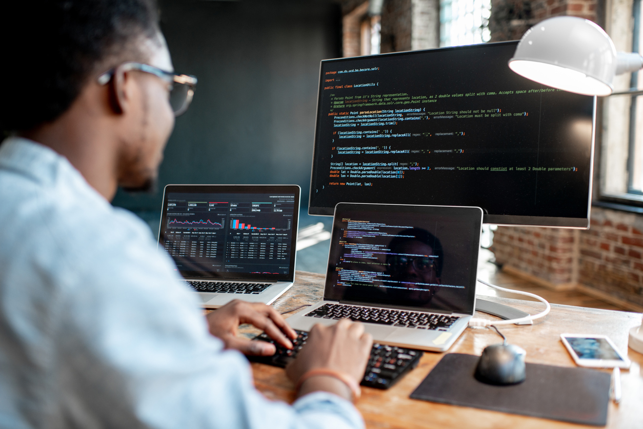 Programmer working with code