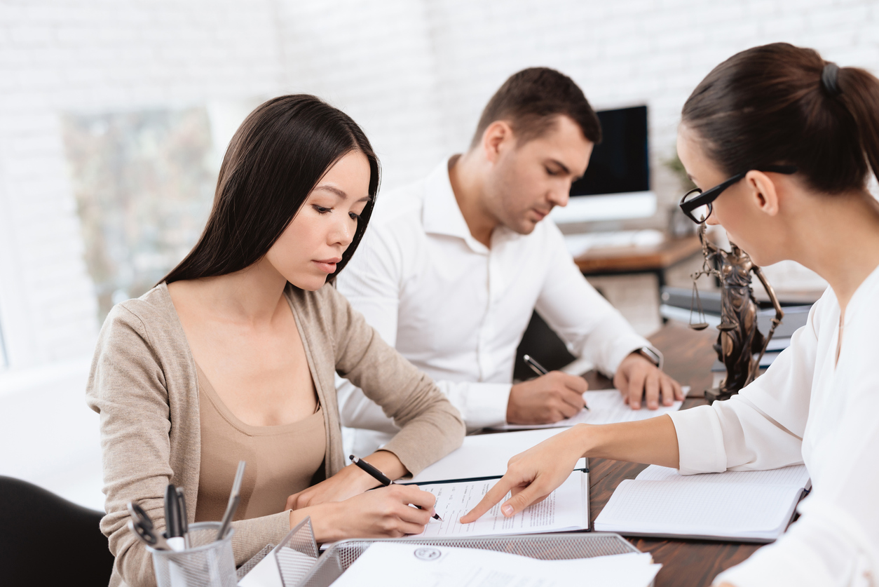 A young couple meeting with a divorce attorney
