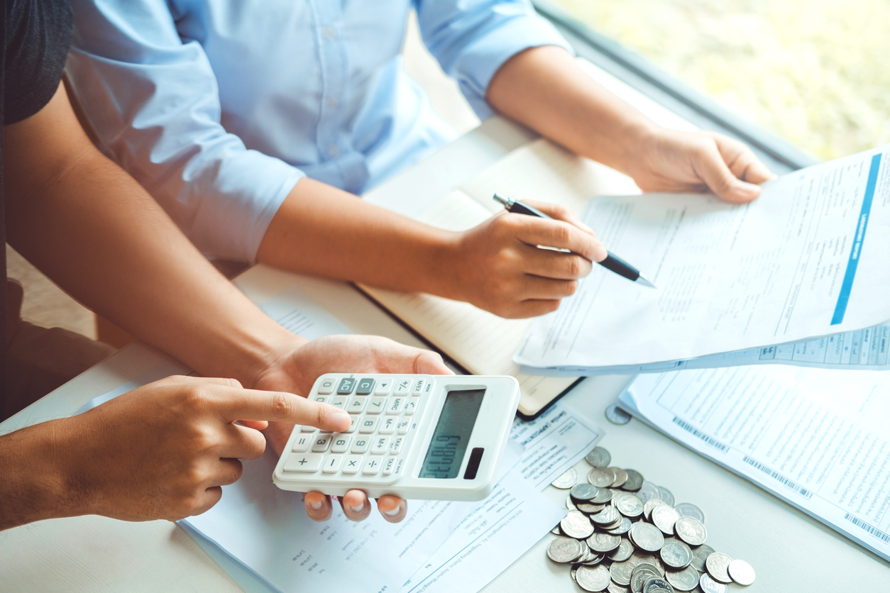 Accountants calculating business expenses