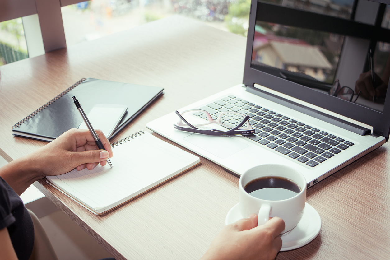 Woman with coffee completing online training course