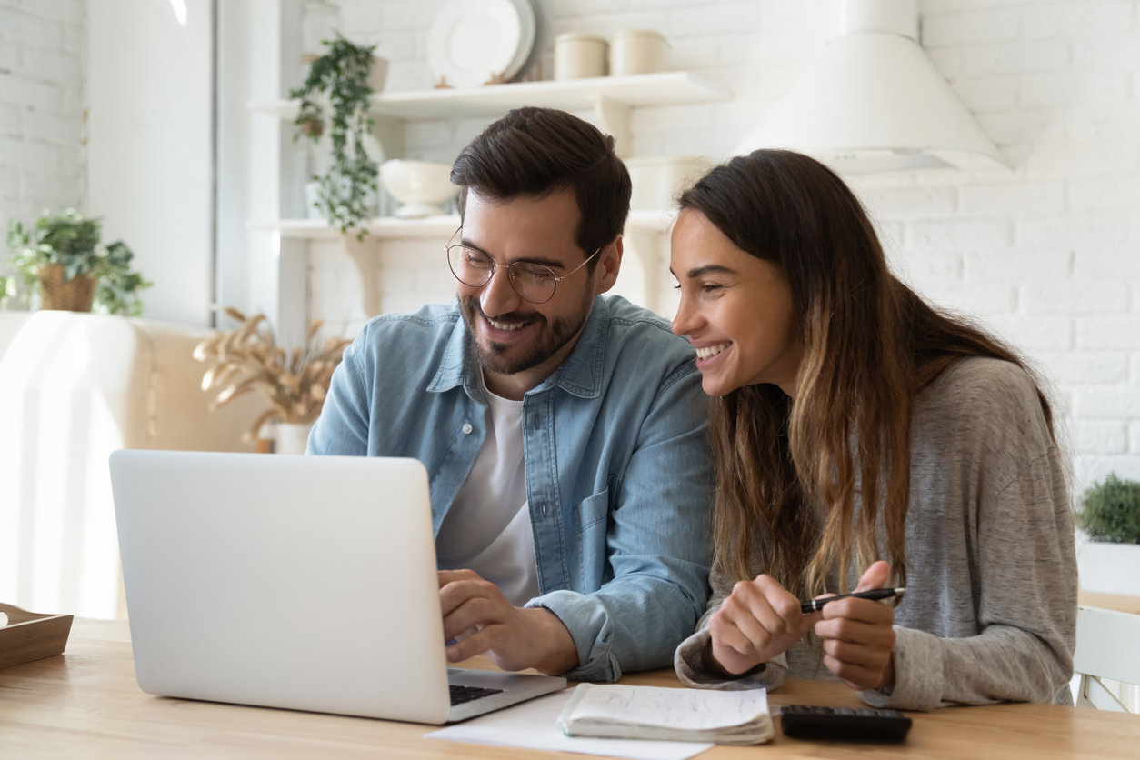 Young couple obtaining business loan online