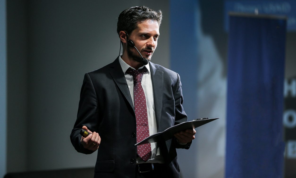 Company director giving a talk at a business event