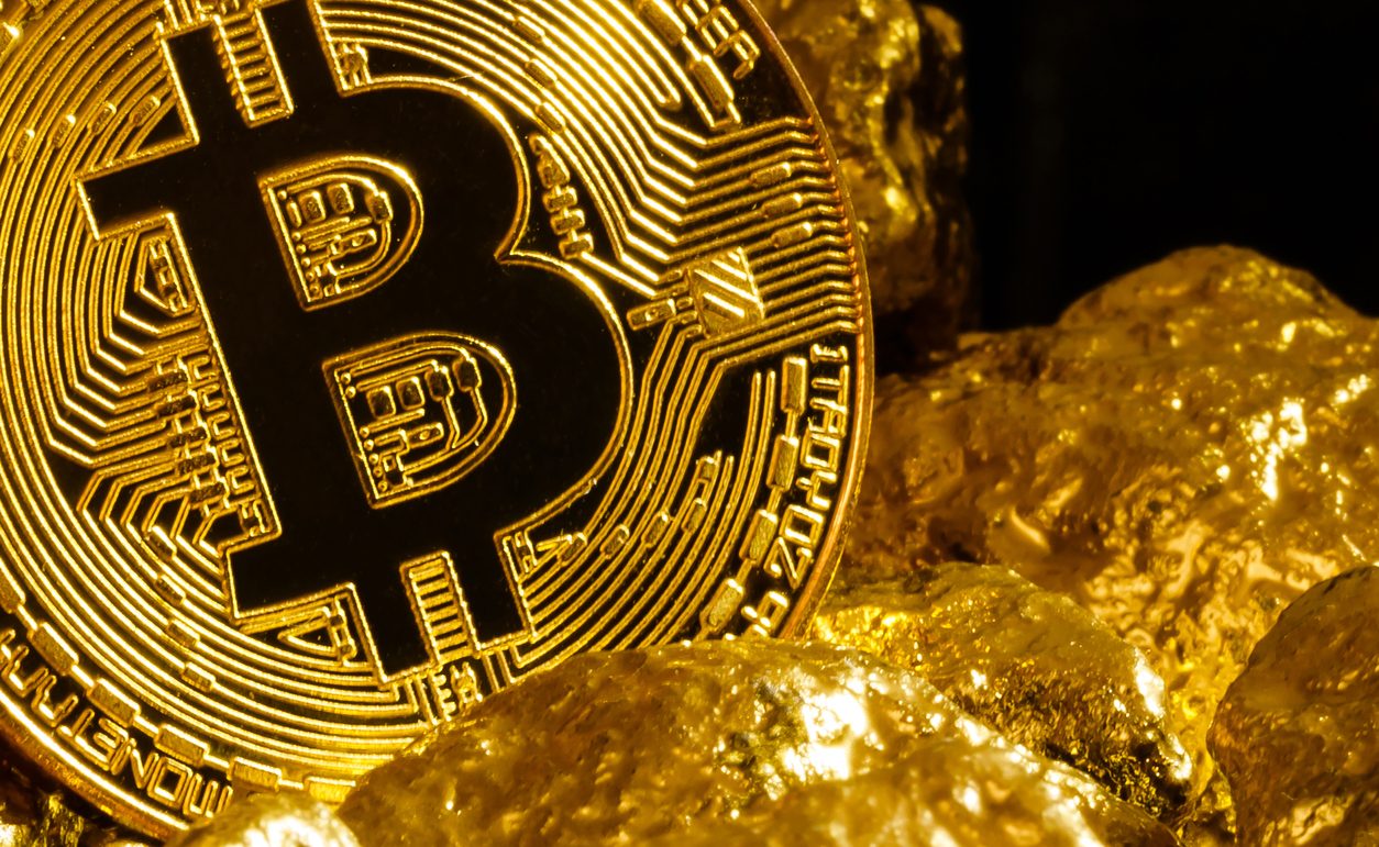 Bitcoin pictured with gold nuggets