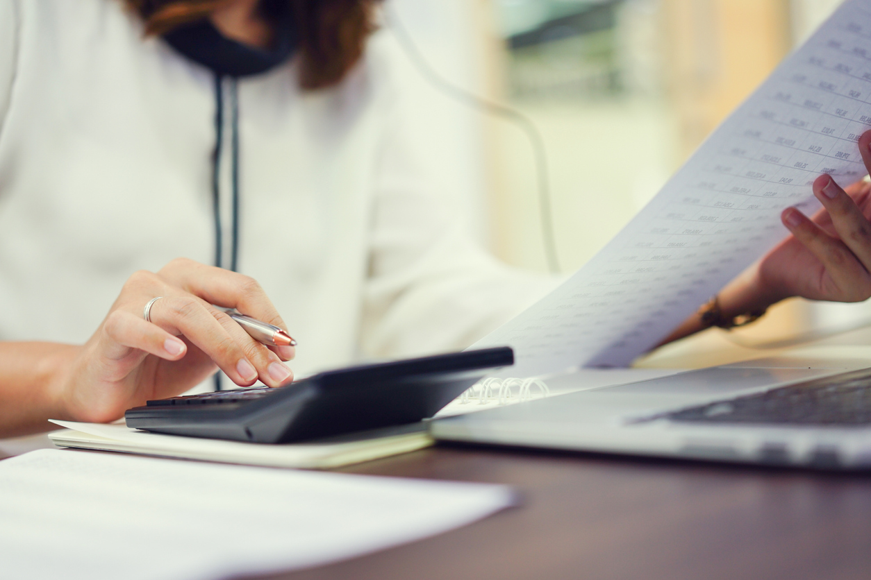 Senior female accountant calculating payroll