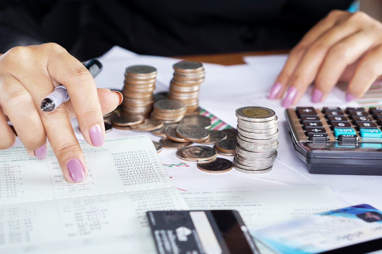 Woman calculating savings against debt