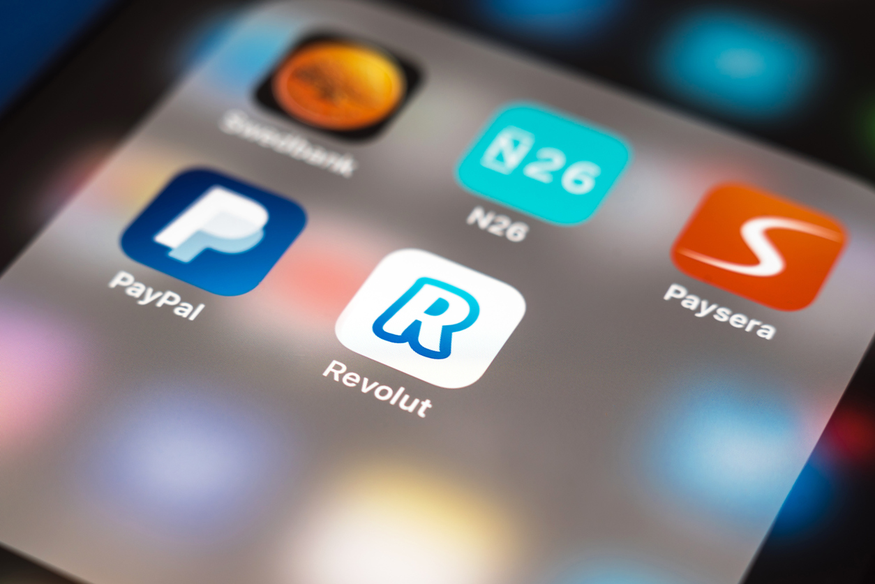 Revolut, PayPal, Paysera and N26 apps displayed on smartphone