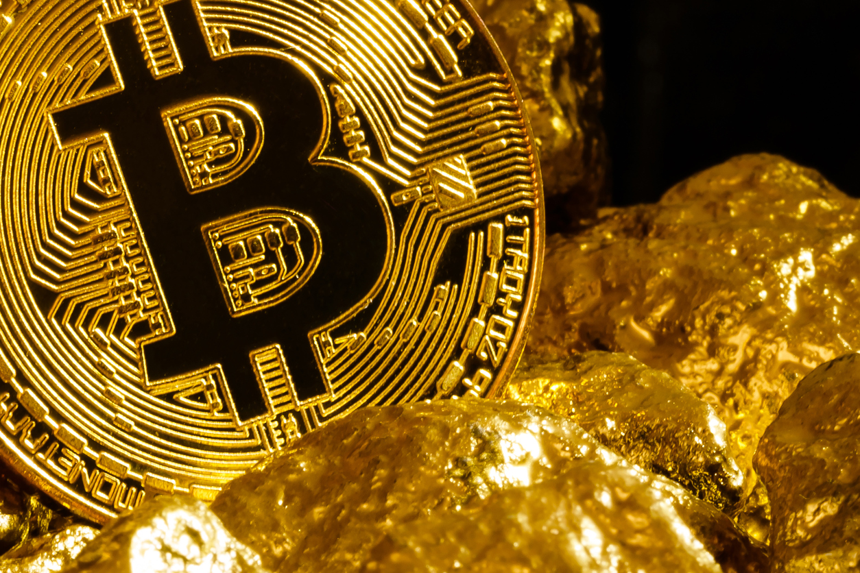 Bitcoin pictured with gold nuggets
