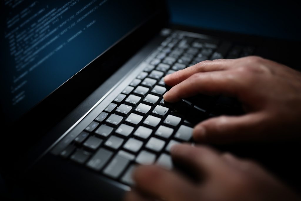 Hacker using keyboard