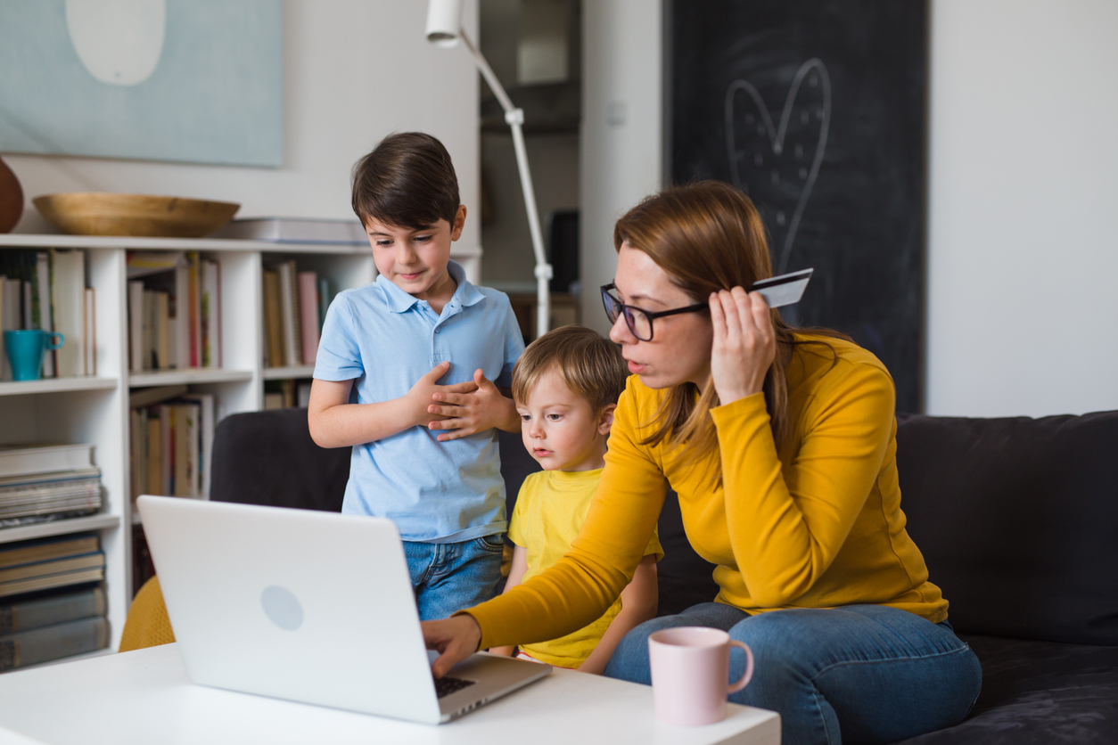 Mother with kids looking at online payday loans