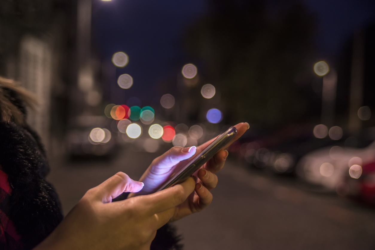 Woman using phone to process payment