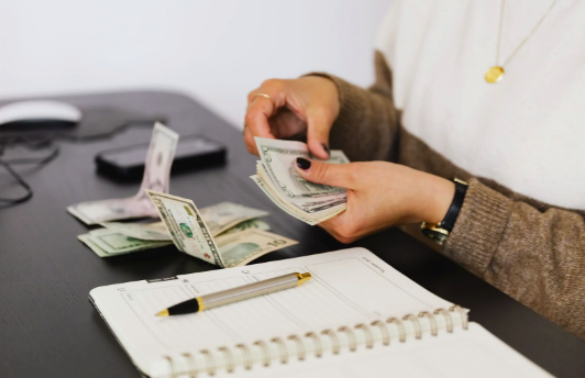 Self-employed business owner counting cash