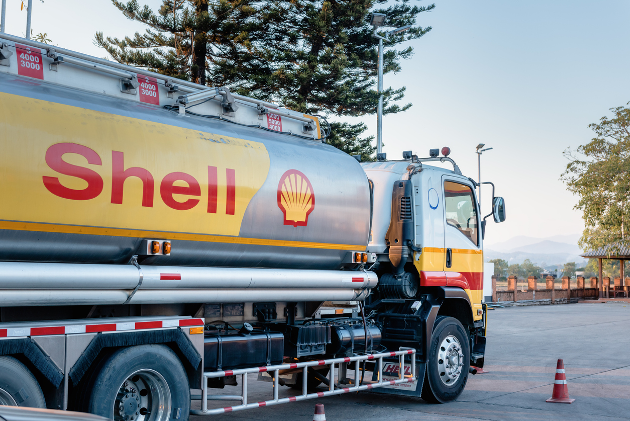 Shell Gas Station and Trailer Truck During Sunset