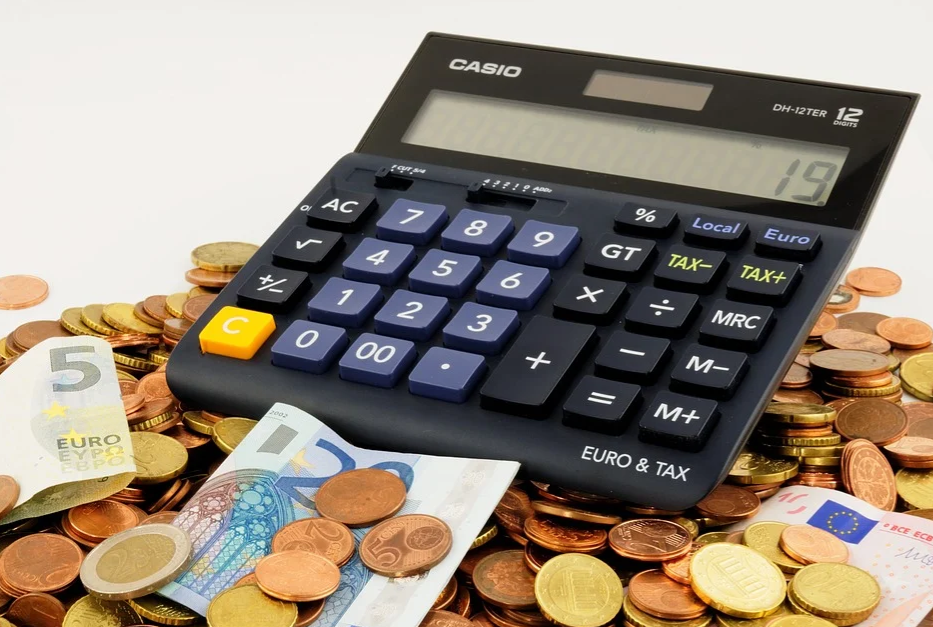 Calculator sat on pile of cash