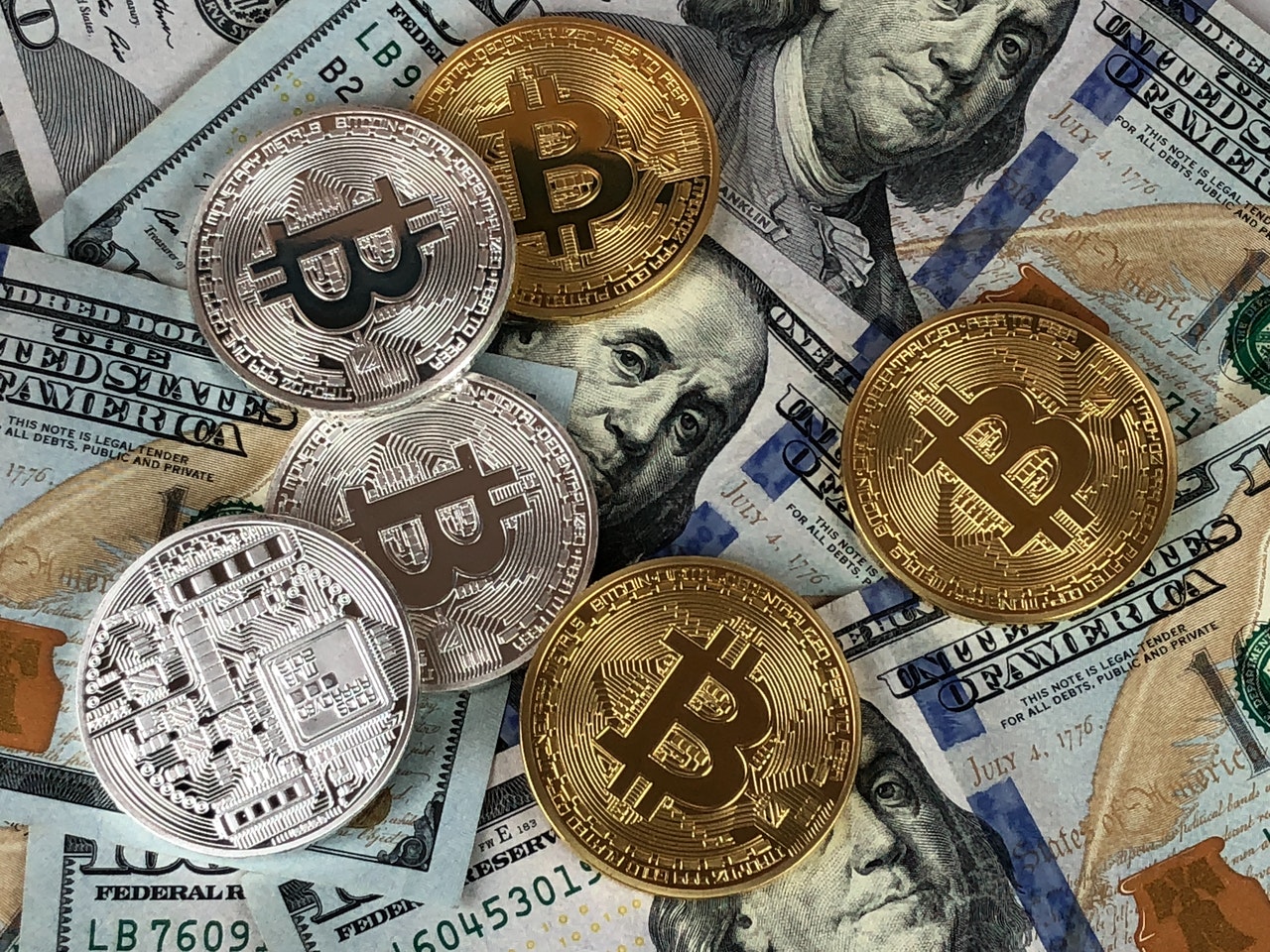 Bitcoin and dollar bills