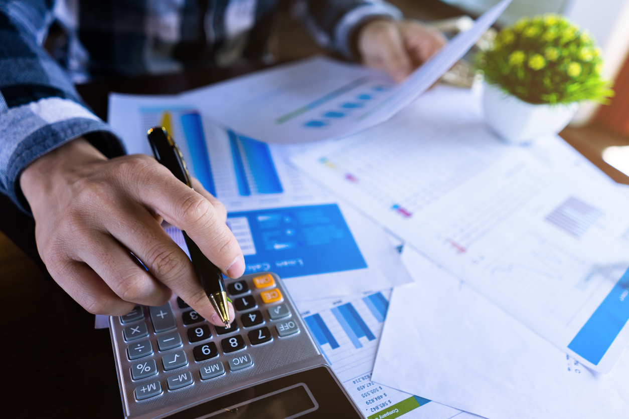 Man working through finance calculations