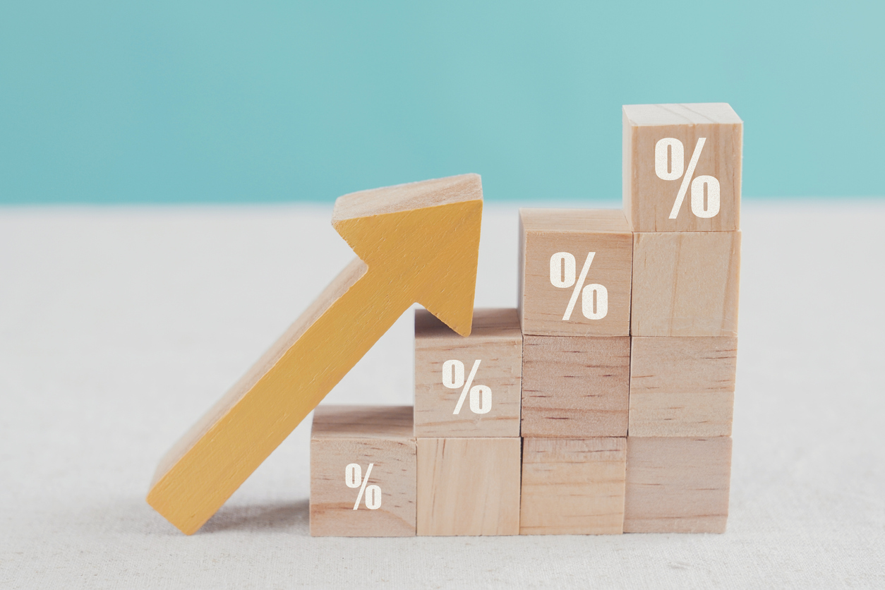 Rising interest rates concept; wood blocks with increasing percentages