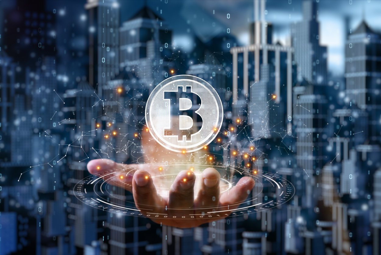 Bitcoin in palm of hand