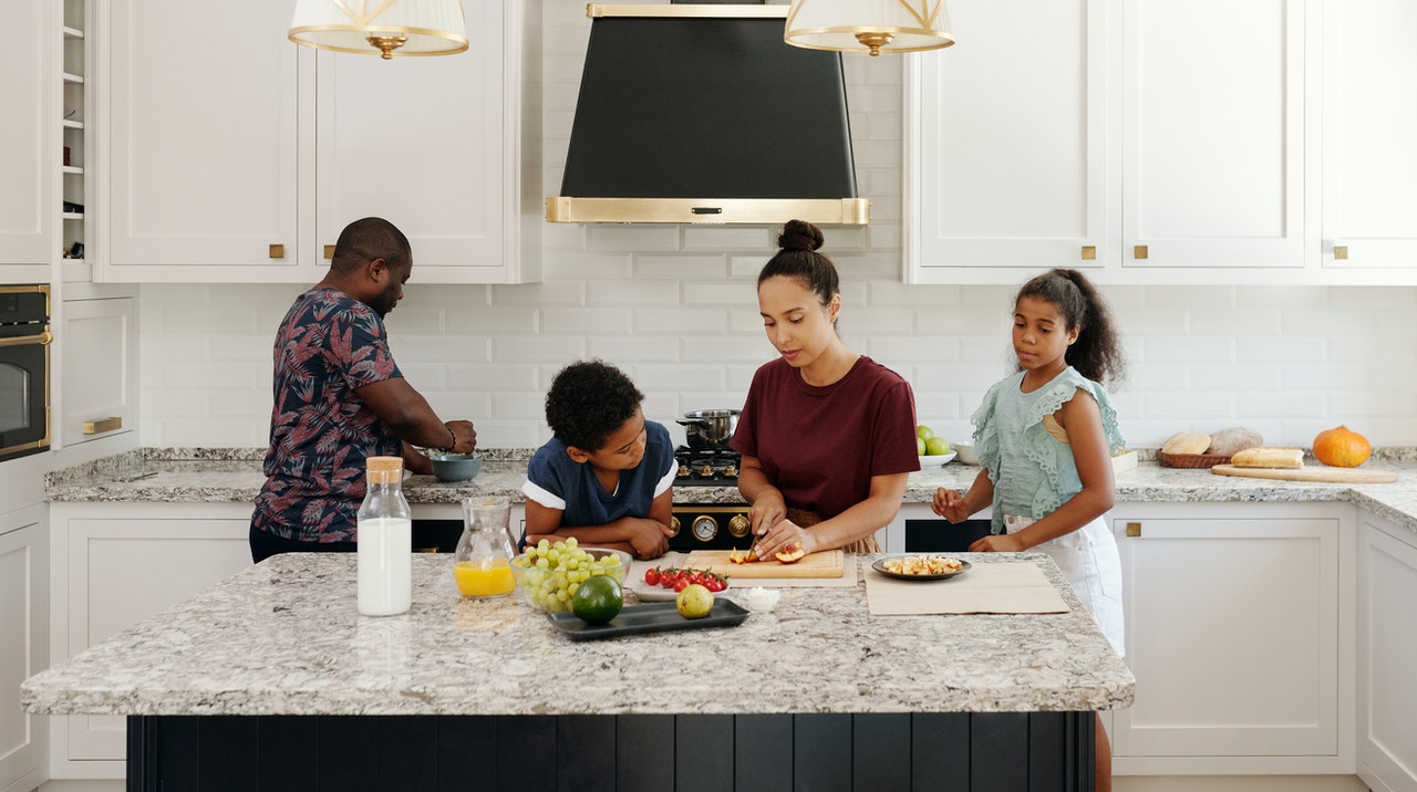 Australian family around kitchen island
