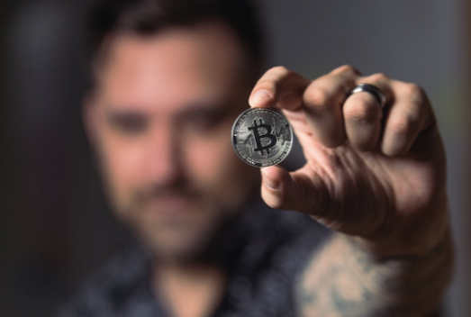 Man holding bitcoin