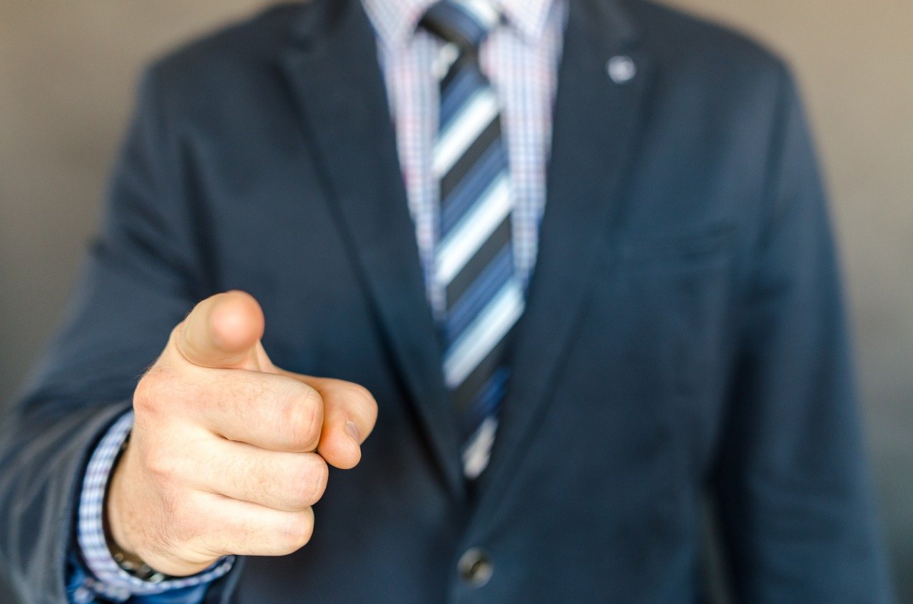 Businessman pointing finger
