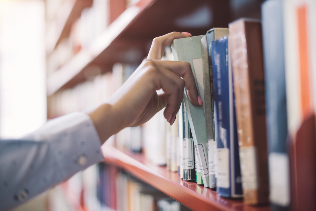 student searching books
