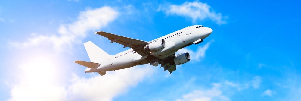 airplane,in,the,flight,,travel,background,with,airplane,flying,in