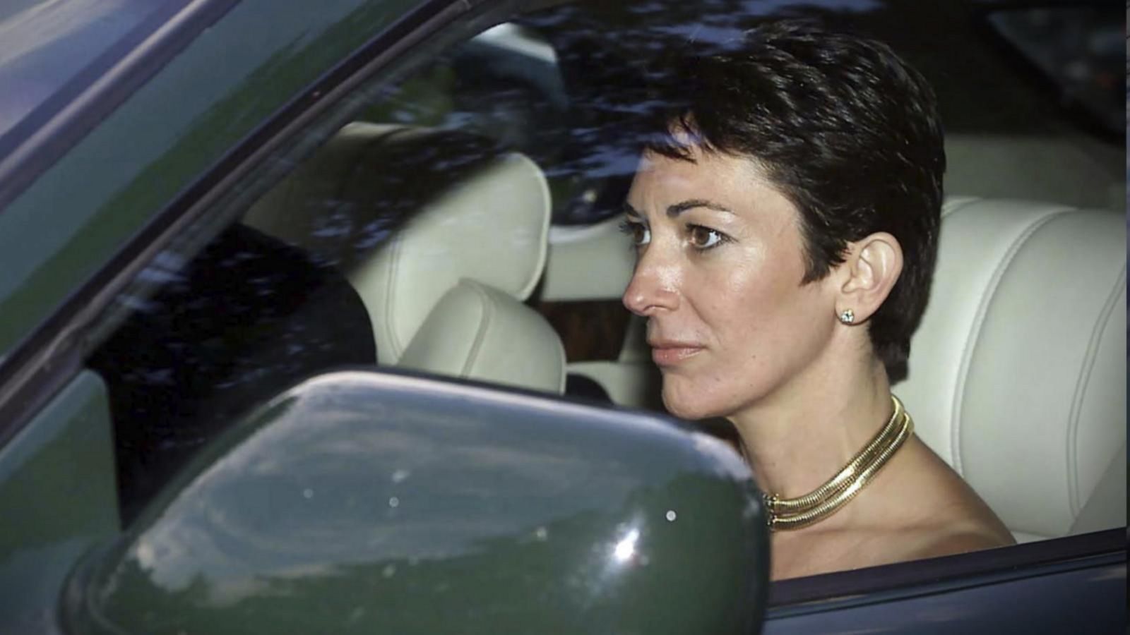 Ghislaine Maxwell driving a luxury vehicle, photographed before her arrest in connection with the Jeffrey Epstein criminal case.