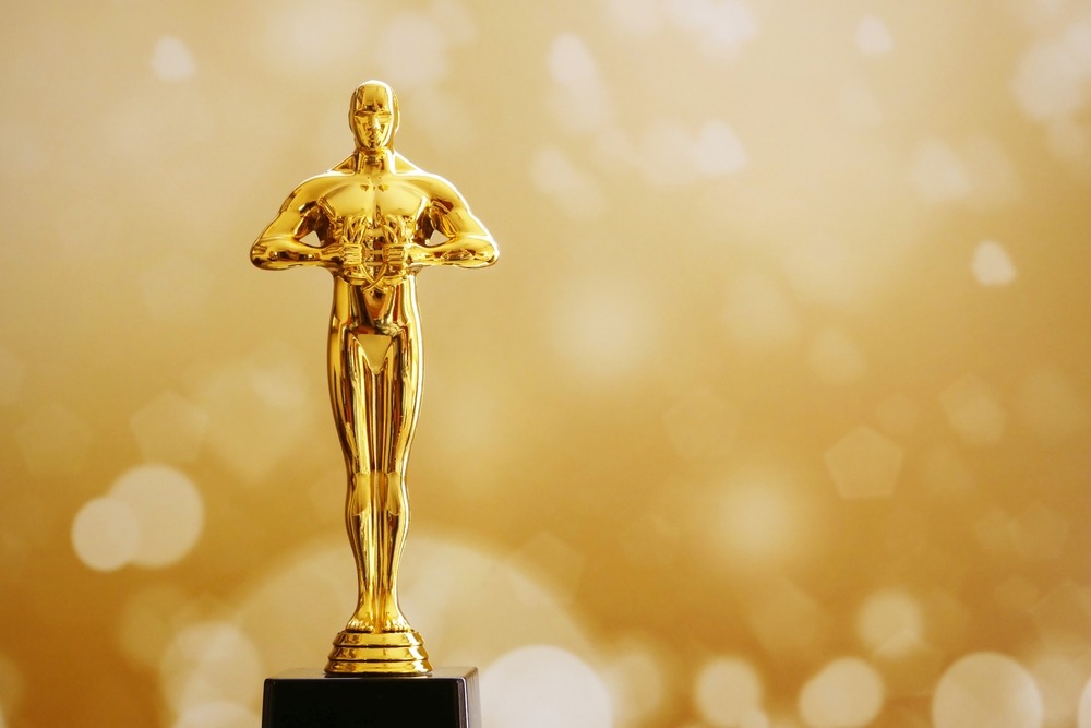 hollywood,golden,oscar,academy,award,statue,on,fireworks,background.,success
