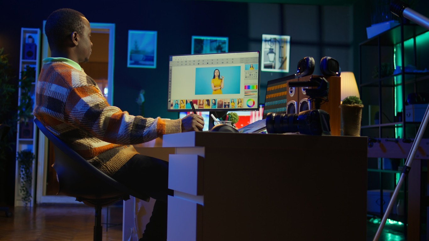 A person editing visuals manually