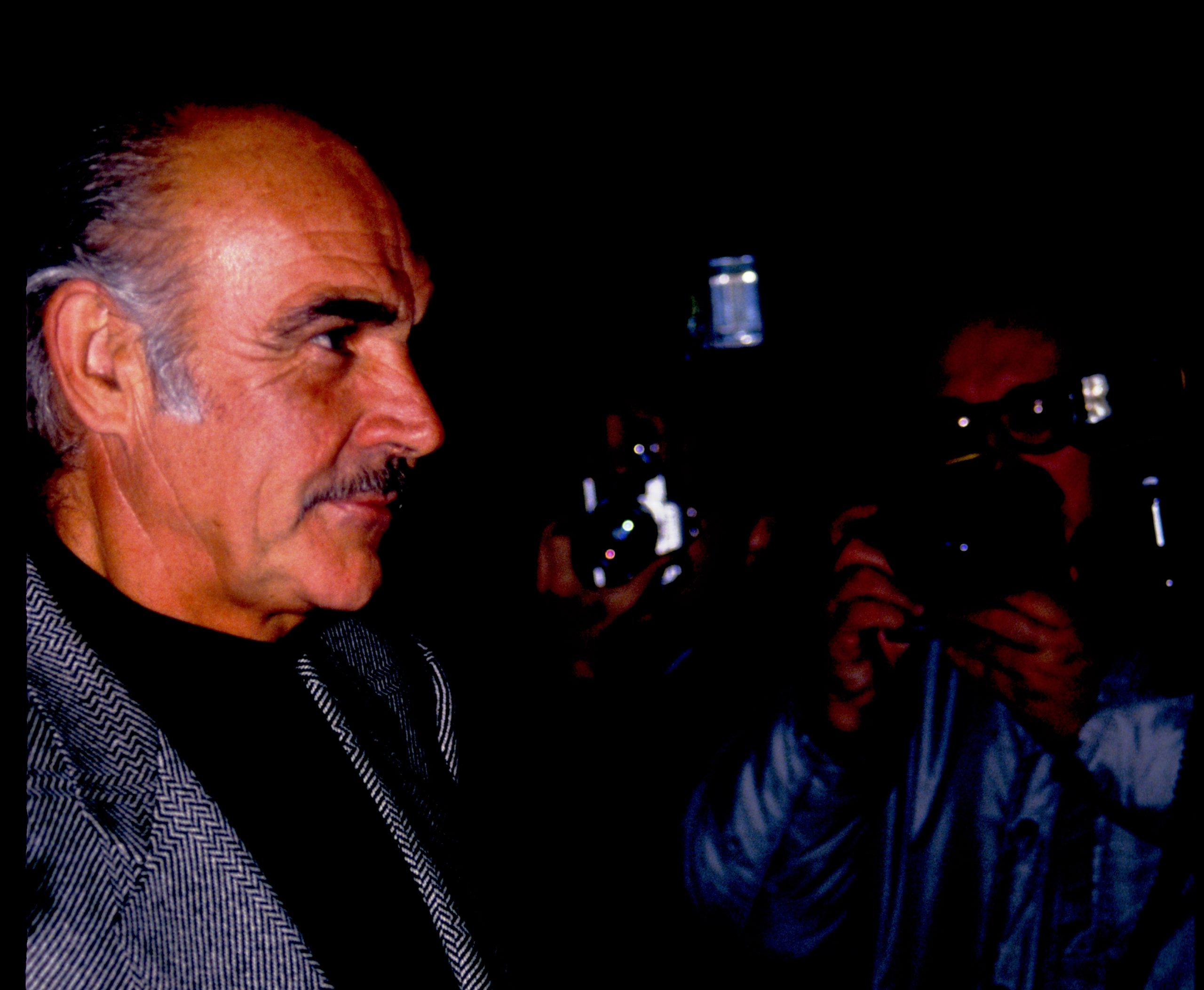 los,angeles, ,circa,1991:,sean,connery,walks,by,paparazzi