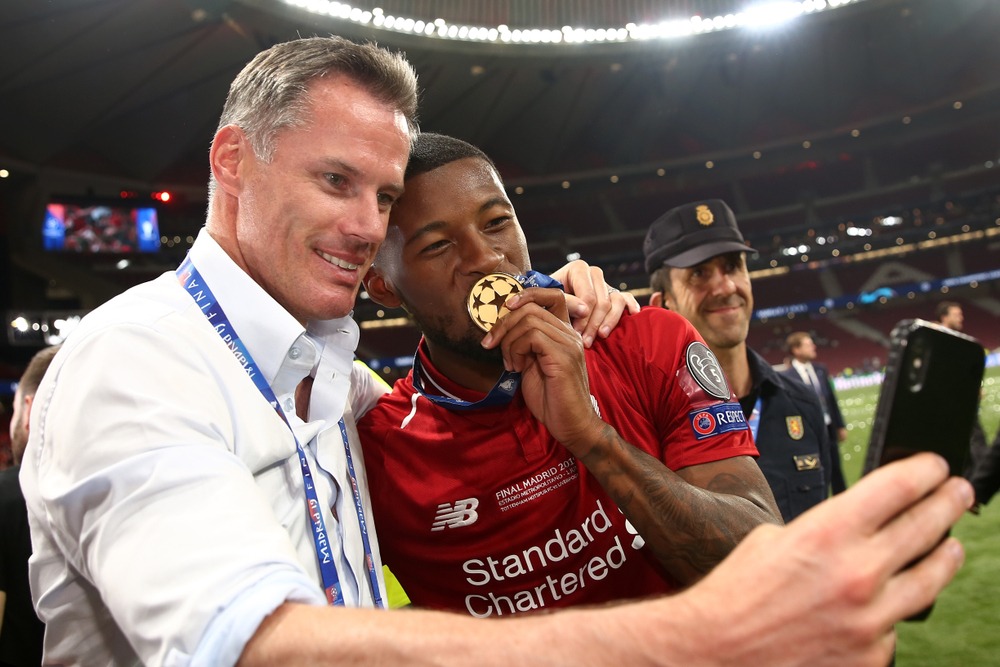 georginio,wijnaldum,of,liverpool,celebrates,with,former,player,,jamie,carragher
