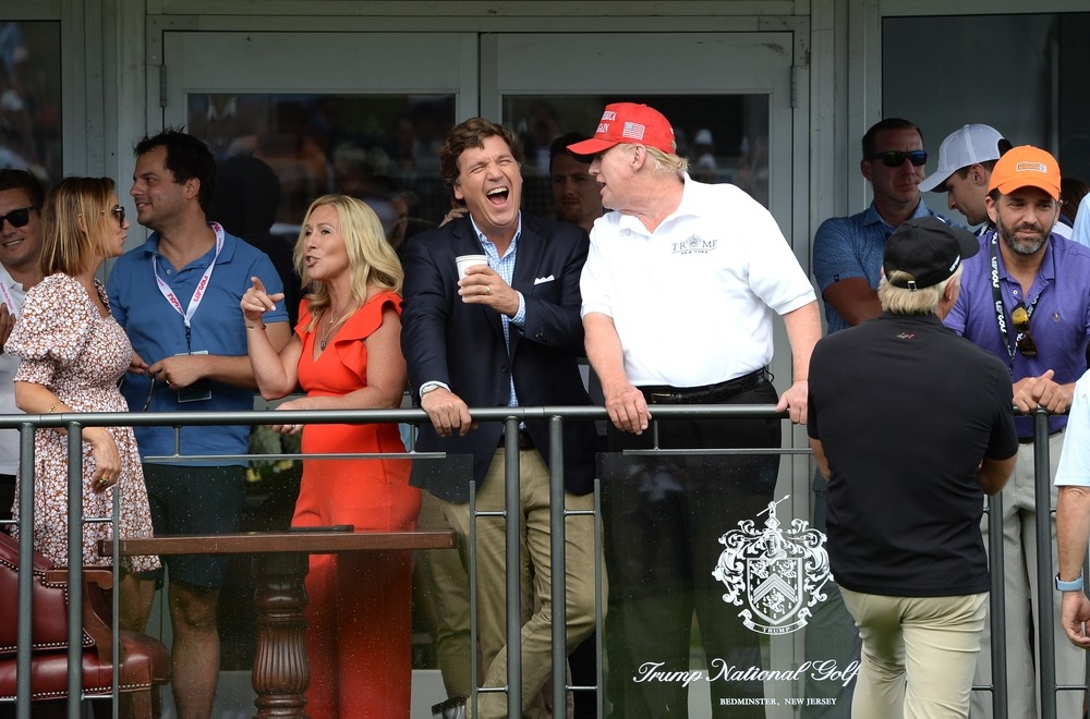 bedminster,nj july,31,2022:,tucker,carlson,(c),jokes,with,former,president,trump