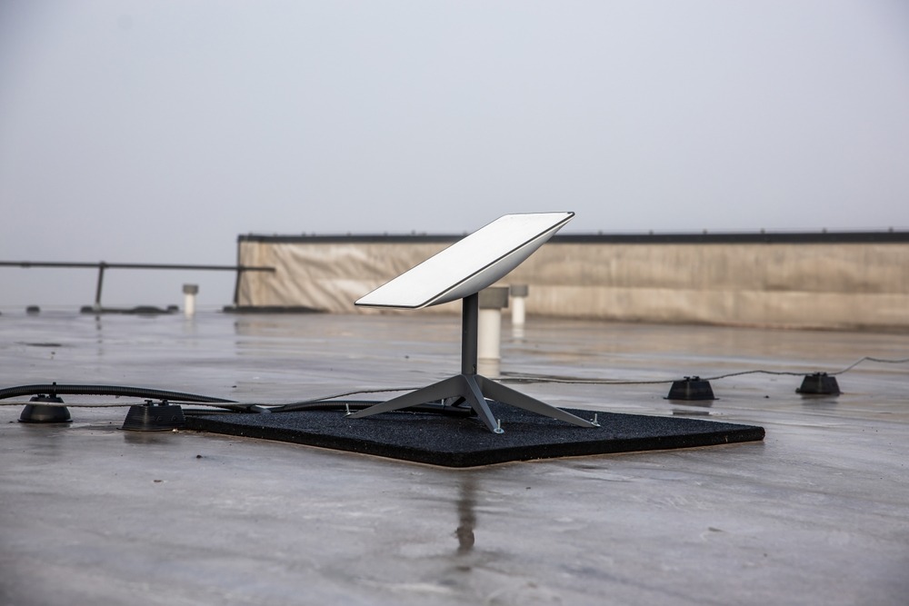 a,starlink,satellite,dish,is,installed,on,a,flat,rooftop,