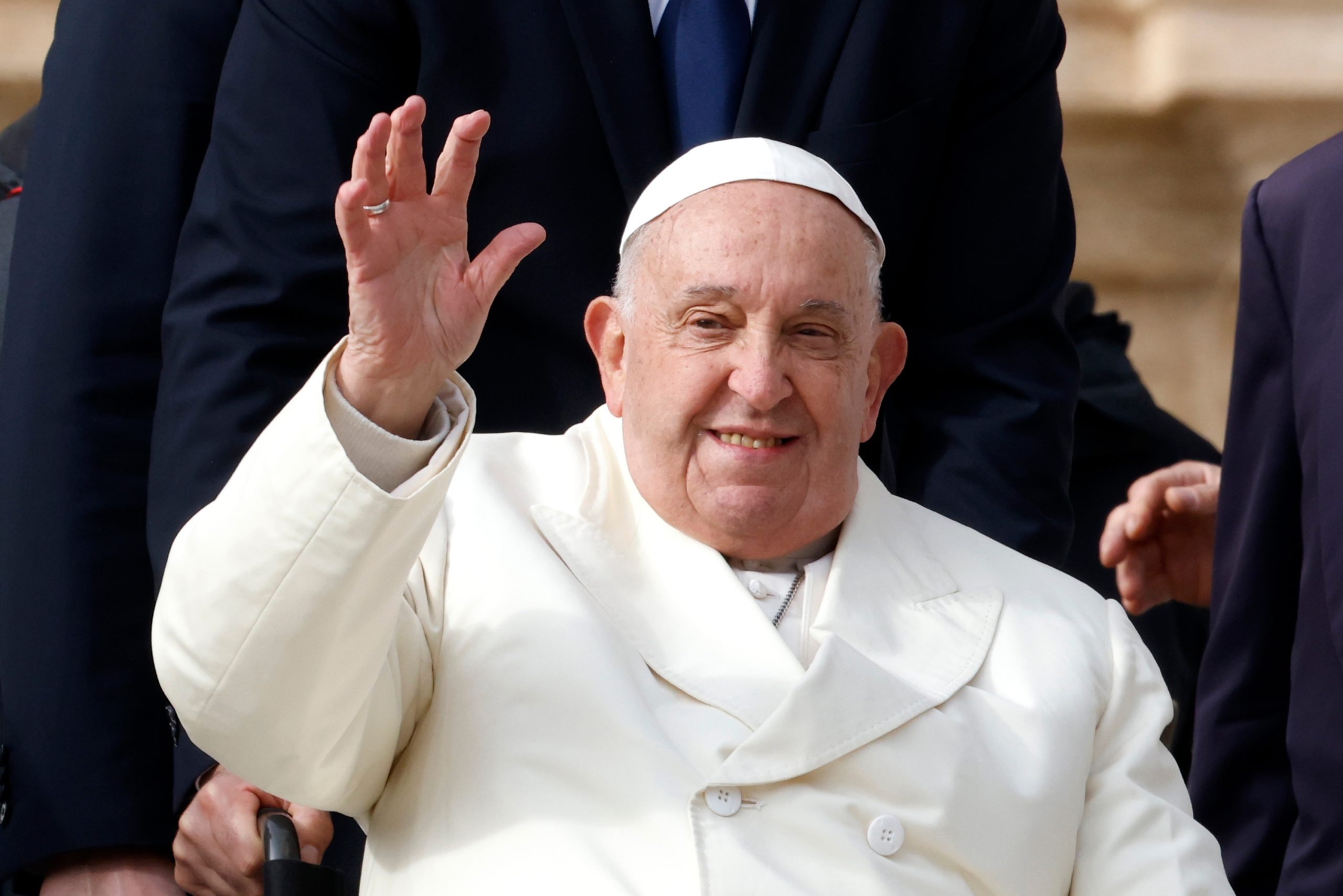 pope,francis,waves,to,the,faithful,at,the,end,of