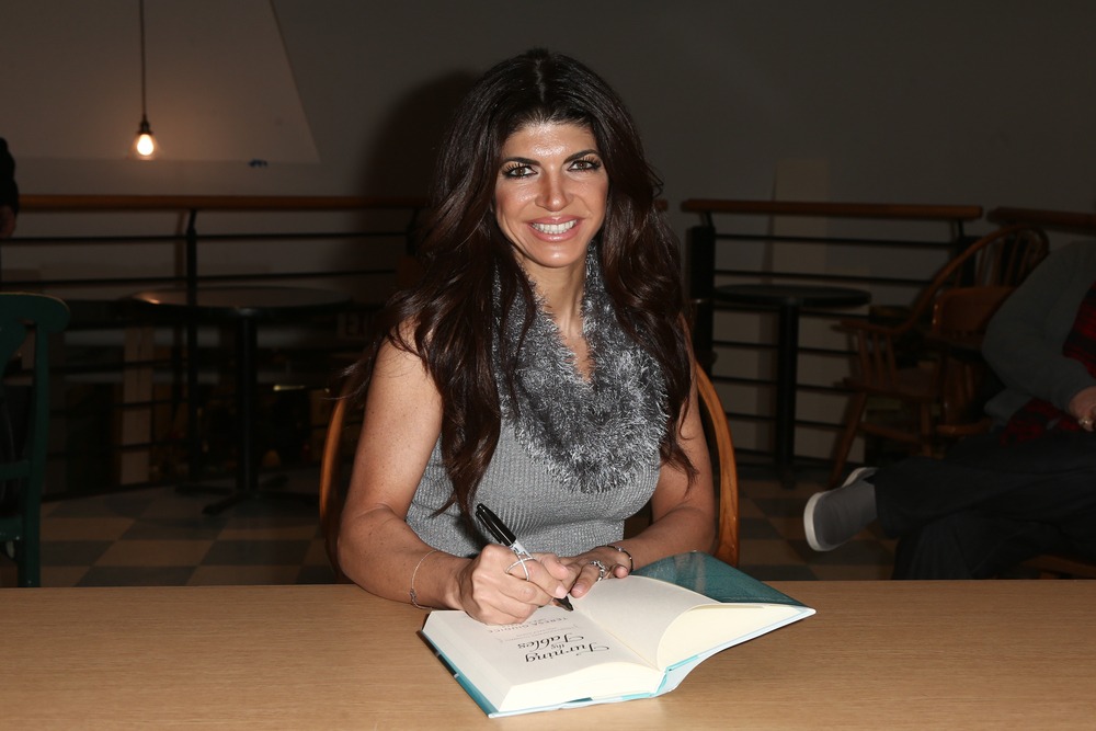new,york feb,16:,tv,personality,teresa,giudice,signs,copies,of