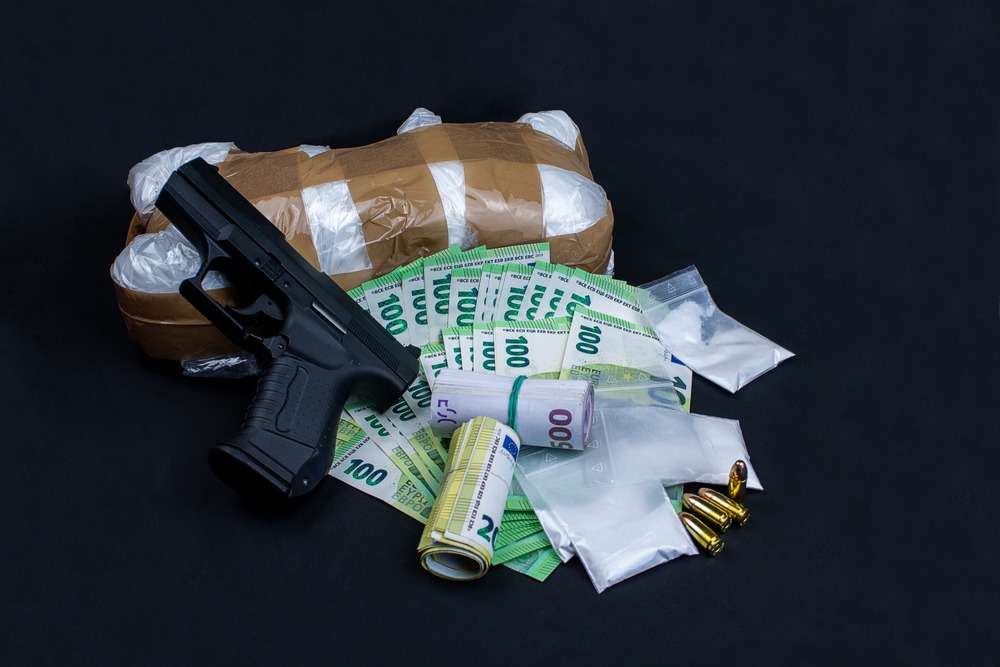 gun,,euro,notes,and,drugs.,the,money,open,and,rolled.