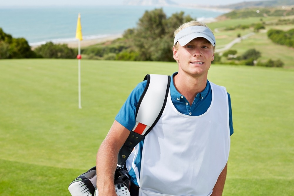 caddy,smiling,on,golf,course