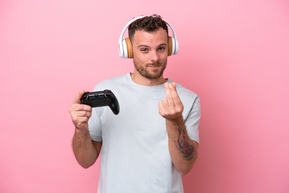 young,brazilian,man,playing,with,video,game,controller,isolated,on