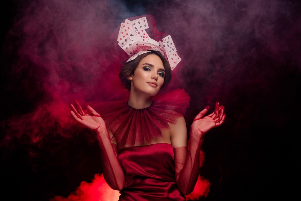 woman,of,frightening,beauty,standing,in,neon,fog,wear,maroon
