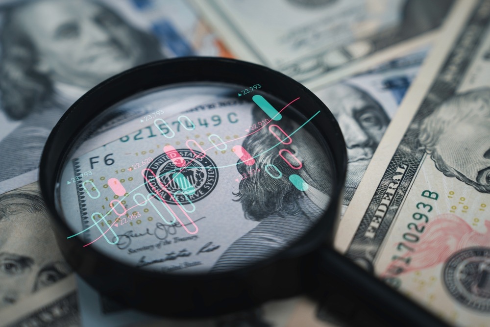 stock,market,chart,inside,magnifier,glass,on,benjamin,franklin,face