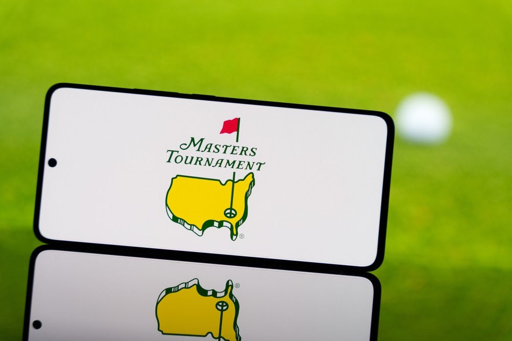 smartphone,displaying,masters,tournament,logo,with,a,blurred,golf,ball