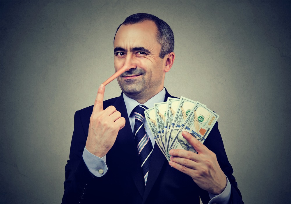 financial,fraud,concept.,liar,businessman,with,dollar,cash