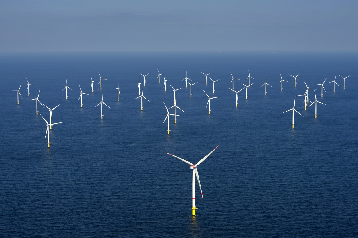 alternative energy. aerial view of offshore windmill park at sea.