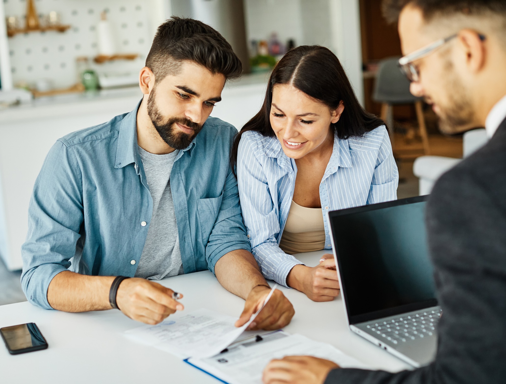young couple shaking hands deal contract real estate investment business agreement agent handshake signing