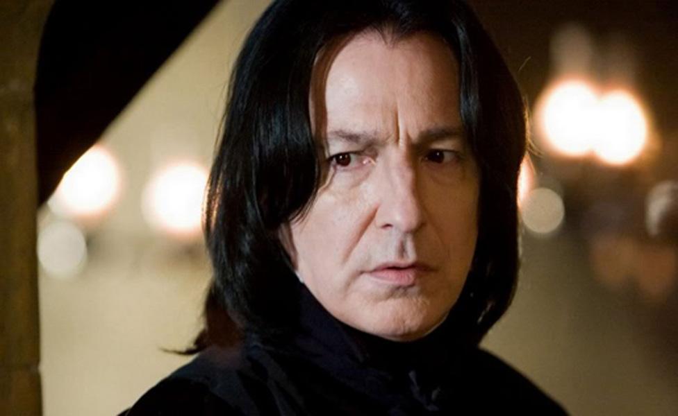 Alan Rickman as Severus Snape in the Harry Potter series, wearing his signature black robes and stern expression.