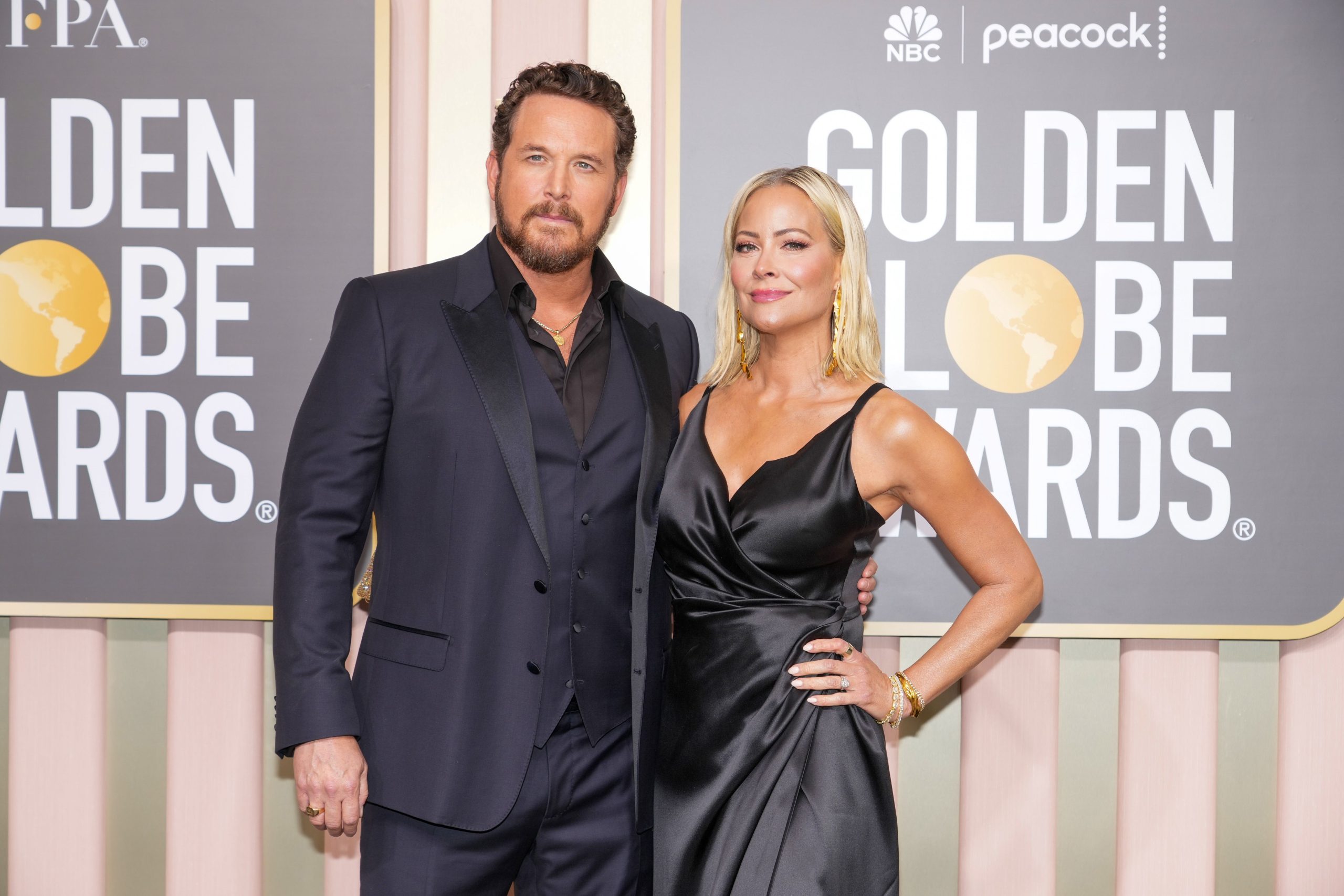 Cole Hauser and his wife Cynthia Daniel all glammed up, posing together at the Golden Globe Awards.