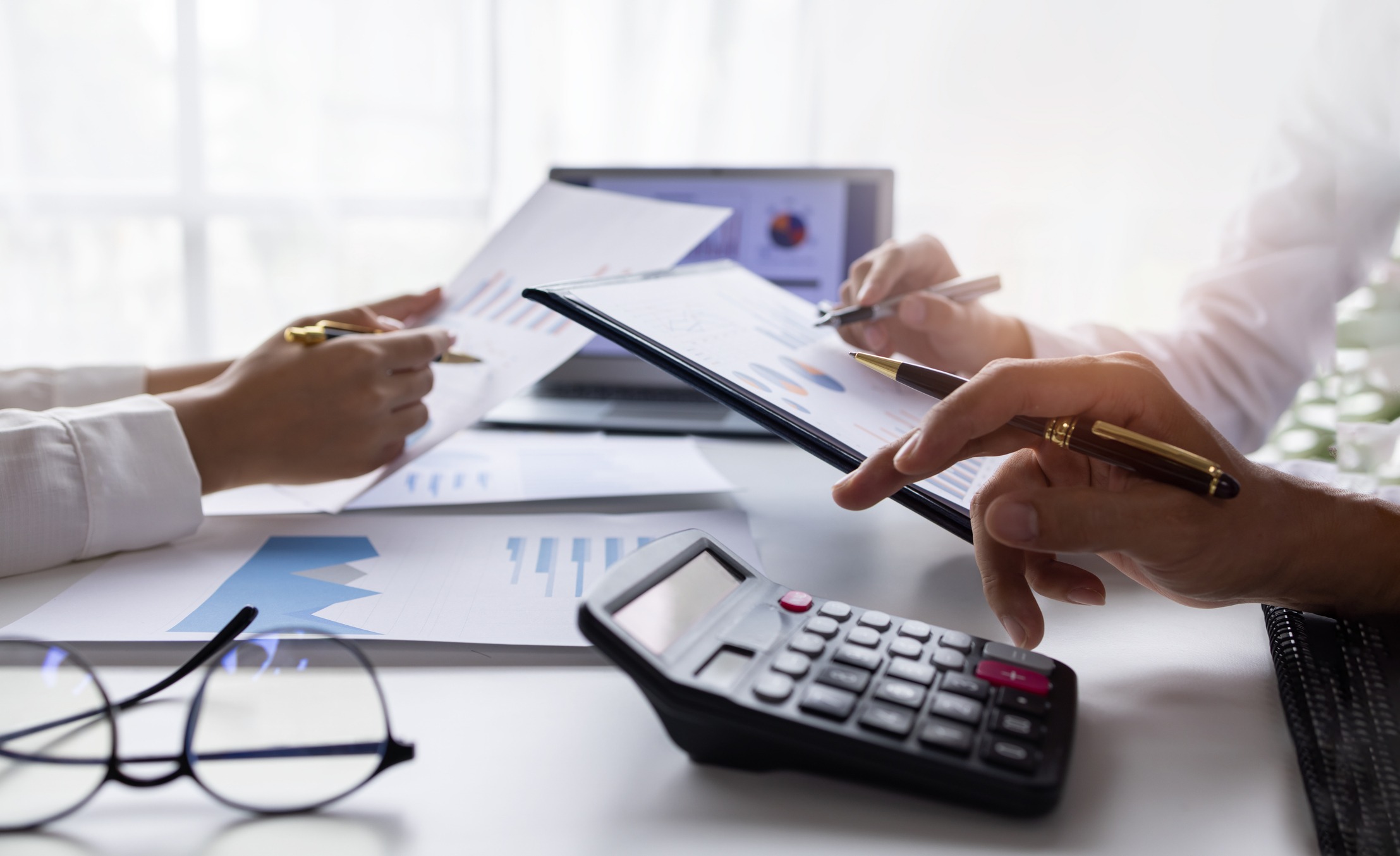 team of business people working at workplace with tablet and document, doing planning analyzing tax financial report, business plan investment, finance analysis economic business discussions.