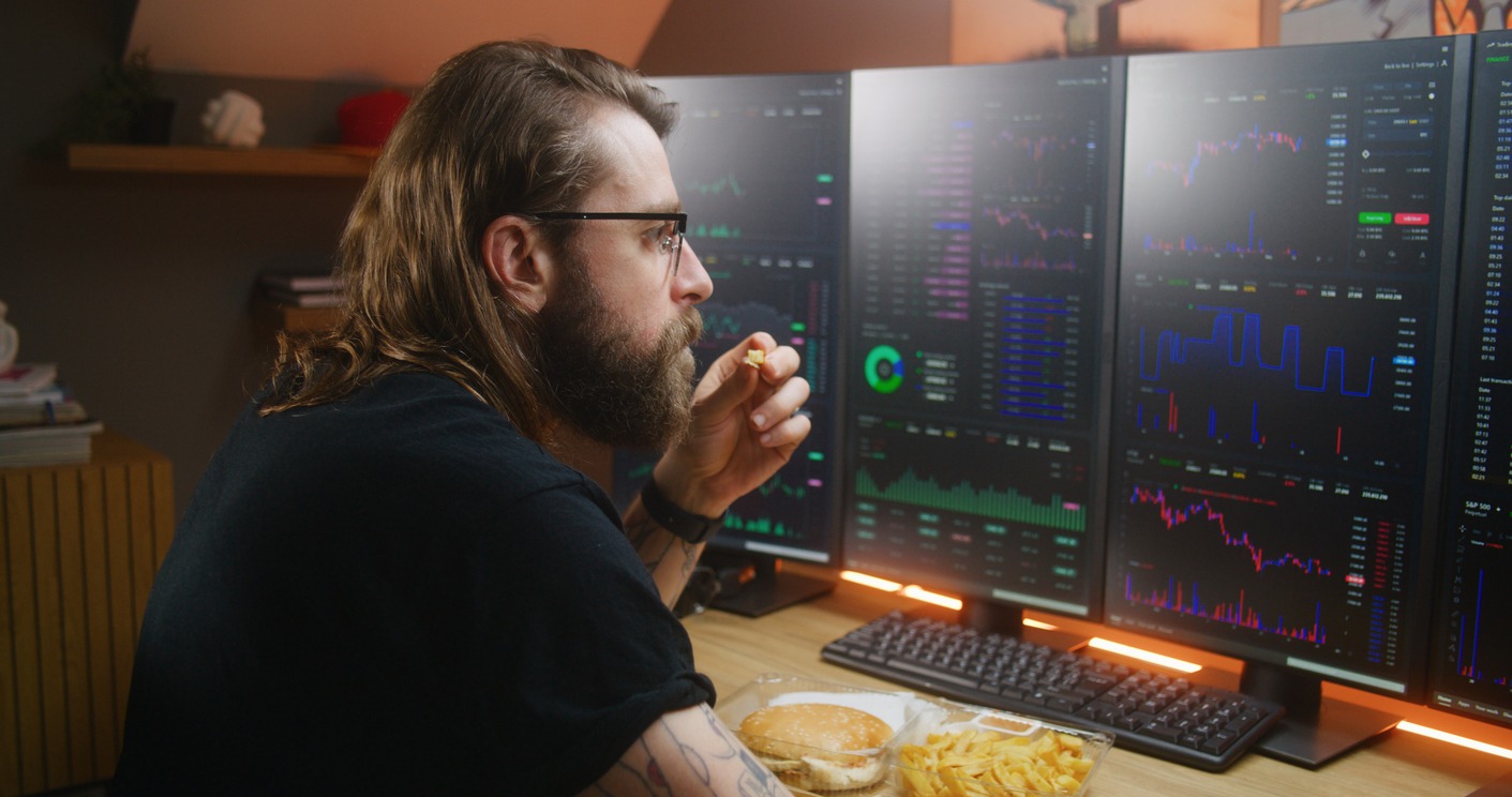concentrated trader watches real time stocks on pc