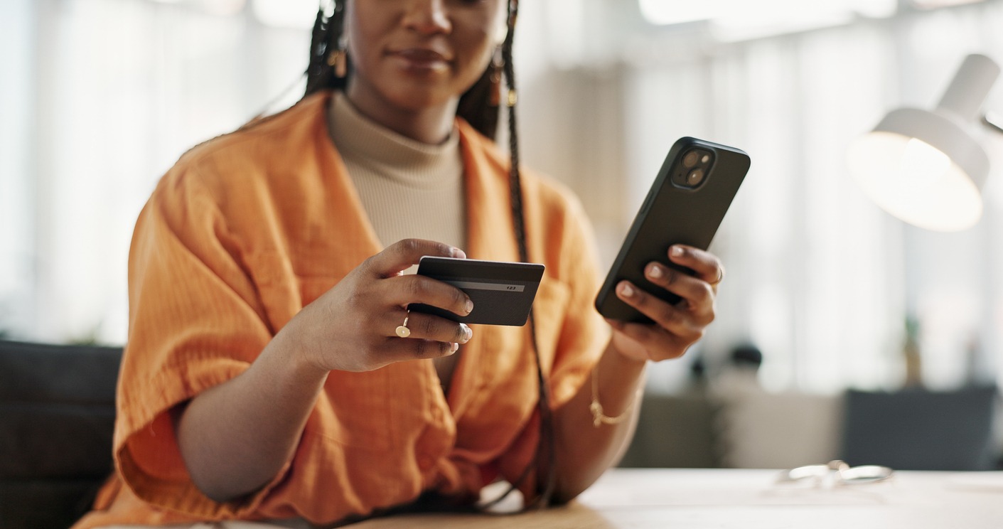 woman, credit card and hands with phone for online shopping, payment or fintech savings at home. closeup, mobile banking and finance for sales, password and code for ecommerce to upgrade subscription